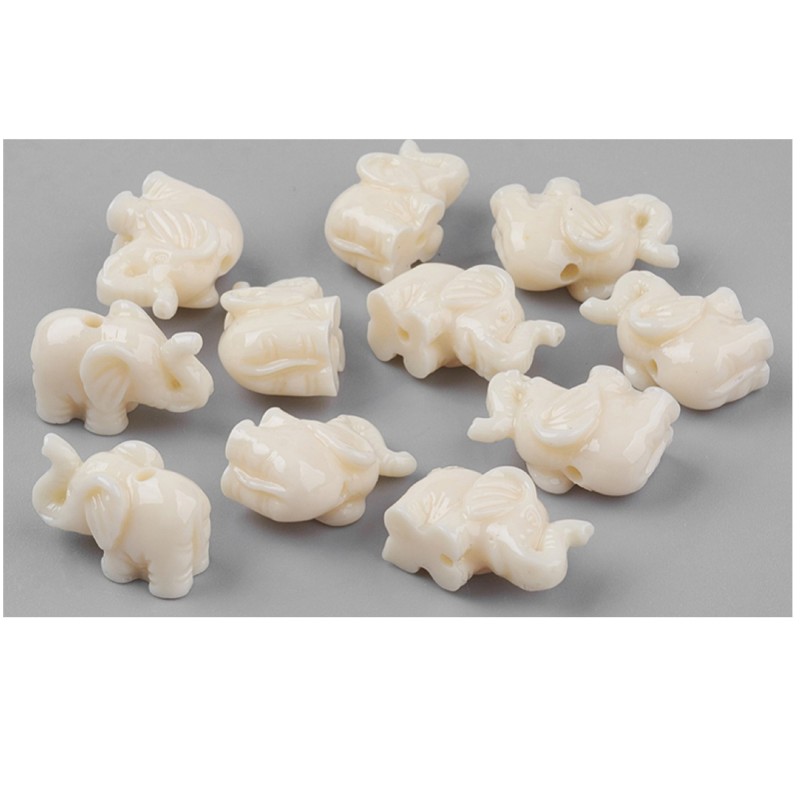 LOT 20 PERLES RESINE:  éléphant crème 17*10mm 
